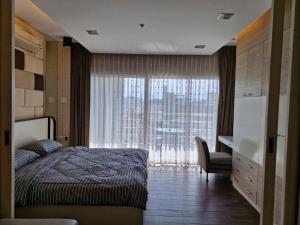 Voodi või voodid majutusasutuse View Talay 6 Pattaya Beach by Anatolia Condo Suite toas