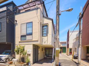 a street view of a house on a city street at casa de tsuru in Osaka