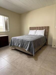 Ένα ή περισσότερα κρεβάτια σε δωμάτιο στο Casa com Piscina +10 φωτογραφίες