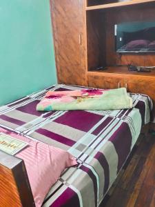 Postel nebo postele na pokoji v ubytování Kavitha nest homestay