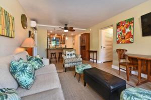 a living room with a couch and a table at Pacific Shores B102 · PacSB102 Family Getaway 3BD Across Beach in Kihei