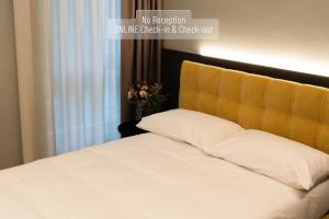 Postel nebo postele na pokoji v ubytování SELF CHECK IN Arbed Living Apartments Arbedo Castione + 17 fotografií