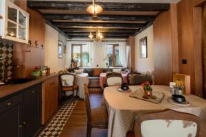 a kitchen with two tables and a dining room at Kuker Hut - Хижа Кукер in Sofia