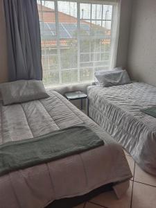 Ένα ή περισσότερα κρεβάτια σε δωμάτιο στο 16 Maz suite