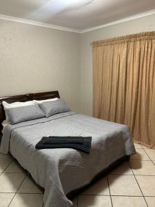 Ένα ή περισσότερα κρεβάτια σε δωμάτιο στο 16 Maz suite