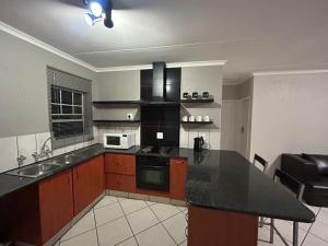 Η κουζίνα ή μικρή κουζίνα στο 16 Maz suite