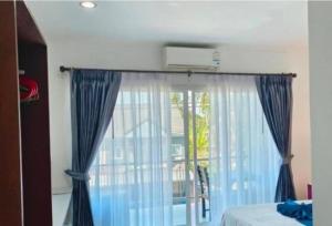 Ένα ή περισσότερα κρεβάτια σε δωμάτιο στο My box in samui