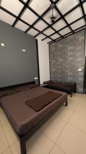 a bedroom with a large bed in a room at Meghamalhar in Mānantoddy +14 photos