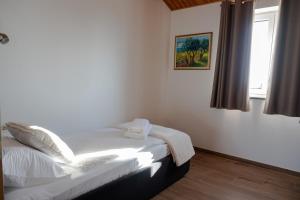 Ένα ή περισσότερα κρεβάτια σε δωμάτιο στο Vila Mira +62 φωτογραφίες