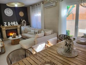 a living room with a couch and a table at bellazaira in Ruidera
