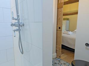 a bathroom with a shower in a room at The Stables - Uk50804 in Cratfield