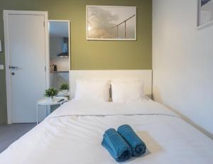 Postel nebo postele na pokoji v ubytování 98 Aparthotel - Botanique 1