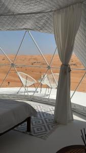 Ένα ή περισσότερα κρεβάτια σε δωμάτιο στο The mirage dome