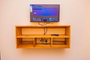 TV a/nebo společenská místnost v ubytování Escape Villa - Kilimanjaro