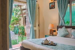 Postel nebo postele na pokoji v ubytování 3BHK Villa with Pvt Pool Near Calangute Beach