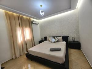 a bedroom with a bed in a room at Villa Luxe Fès avec Piscine & Spa, proche aéroport, Private Hammam in Fès +47 photos