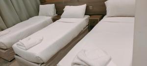 Ένα ή περισσότερα κρεβάτια σε δωμάτιο στο فندق دار المتكاملة 3