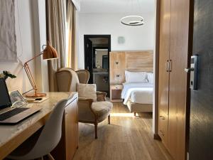 Ένα ή περισσότερα κρεβάτια σε δωμάτιο στο Areos 