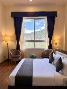 Postel nebo postele na pokoji v ubytování Mazong The Four Season Resort in Gangtok