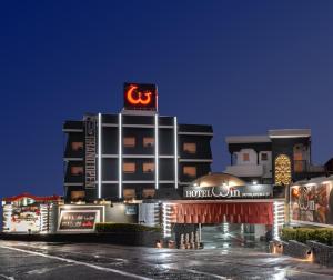 a hotel with a sign on top of a building at ホテル ダブルイン茨木 in Ibaraki
