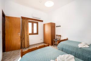 Ένα ή περισσότερα κρεβάτια σε δωμάτιο στο Serenity House - Magic sunsets