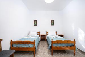 Ένα ή περισσότερα κρεβάτια σε δωμάτιο στο Serenity House - Magic sunsets +7 φωτογραφίες