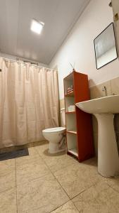 a bathroom with a sink and a toilet at Apart Granadero in Santiago del Estero
