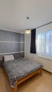 Postel nebo postele na pokoji v ubytování Apartman Lav
