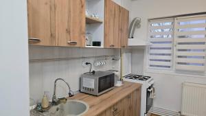 Η κουζίνα ή μικρή κουζίνα στο Opio's House