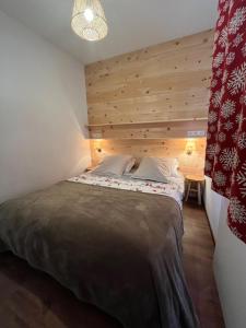 En eller flere senge i et værelse på Les Granges d'Arvieux, magnifique 6 couchages