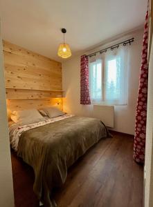 En eller flere senge i et værelse på Les Granges d'Arvieux, magnifique 6 couchages