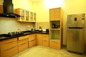 Kuchyň nebo kuchyňský kout v ubytování The Peace- 2BHK Pool Villa