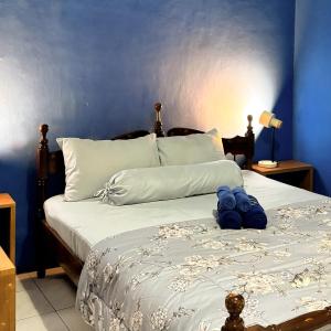 En eller flere senge i et værelse på Hof Warna Guesthouse