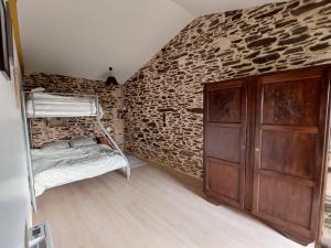 Ένα ή περισσότερα κρεβάτια σε δωμάτιο στο La Tanière du Renard