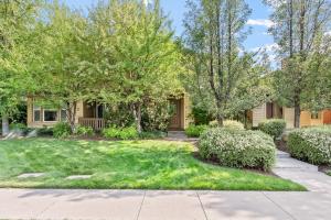a house with a yard with grass and trees at Old Mill Magic in Bend