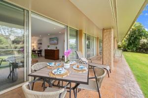 a dining room with a table and chairs at Maui Kaanapali Villas 119 · MKV 119 Newly Remodeled Garden View in Kahana