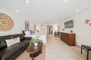 a living room with a bed and a couch at Maui Kaanapali Villas 119 · MKV 119 Newly Remodeled Garden View in Kahana