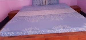 En eller flere senge i et værelse på Saran Resort room 10