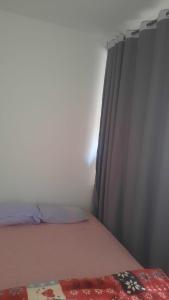 a bedroom with a bed with a curtain and a bedspread at sweet area in Mirleft
