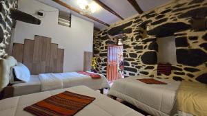 Postel nebo postele na pokoji v ubytování Hotel Peru Ollantay