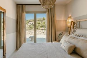 Postel nebo postele na pokoji v ubytování Assos Riverie + 81 fotografií