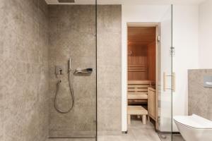 Koupelna v ubytování Hubertus Logis Apartments + 37 fotografií
