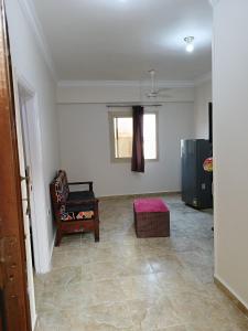 an empty living room with a couch and a window at One room apartment in Marsa Alam City +13 photos