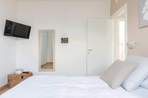 Postel nebo postele na pokoji v ubytování B&B Le Magnolie + 2 fotografie