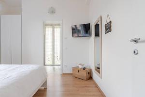 TV a/nebo společenská místnost v ubytování B&B Le Magnolie