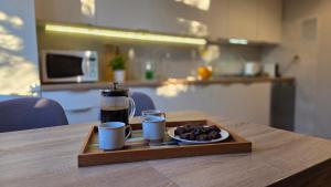 Køkken eller tekøkken på Piątka - Apartamenty Parkowe