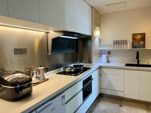 Kuchyň nebo kuchyňský kout v ubytování Shanghai Hongmin Inn