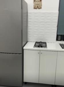 Η κουζίνα ή μικρή κουζίνα στο Aurora Flavia Suites