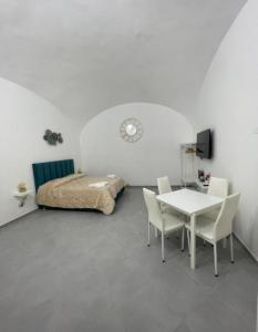 Ένα ή περισσότερα κρεβάτια σε δωμάτιο στο Aurora Flavia Suites