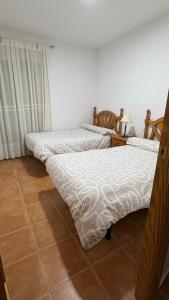 Ένα ή περισσότερα κρεβάτια σε δωμάτιο στο Poseidón